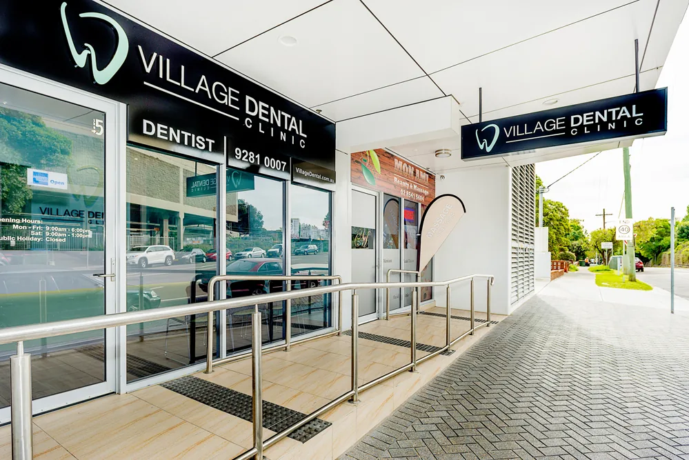 The step-free entrance to Village Dental Kogarah on Station Street, under the practice's illuminated sign